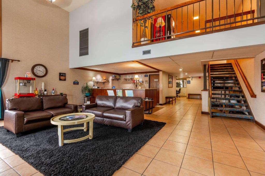 a living room with two couches and a table at Days Inn by Wyndham Coeur d'Alene in Coeur d'Alene