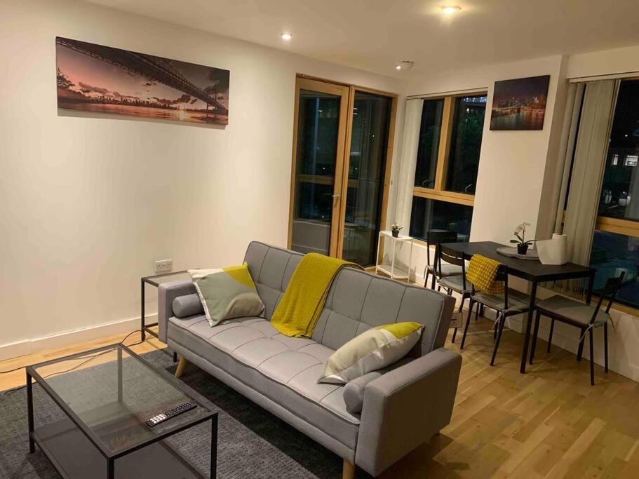 a living room with a couch and a table at 2 Bedrooms Apartment In RG Centre in Reading