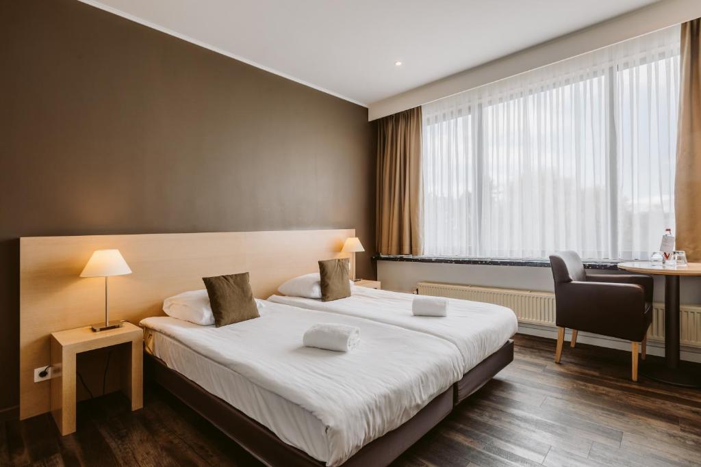 Postel nebo postele na pokoji v ubytování Serwir Hotel