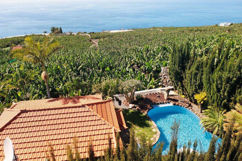an aerial view of a house and a pool in a field at Las Vetas in Tijarafe
