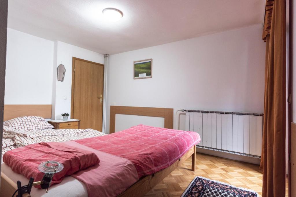 Postel nebo postele na pokoji v ubytování Apartment Satya