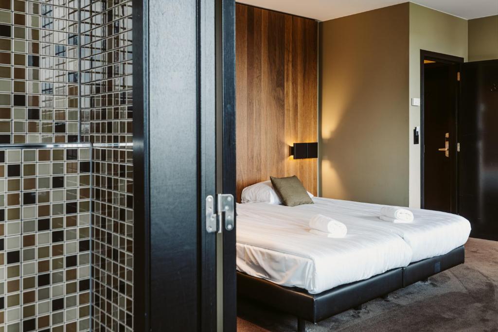 Postel nebo postele na pokoji v ubytování Serwir Hotel