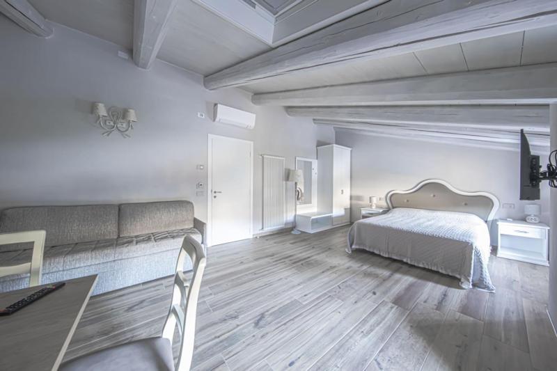 Postel nebo postele na pokoji v ubytování B&B Ca' Bernai