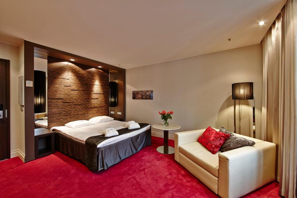 Postel nebo postele na pokoji v ubytování Tallink Hotel Riga
