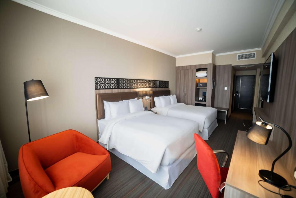 Postel nebo postele na pokoji v ubytování Doubletree By Hilton Trujillo