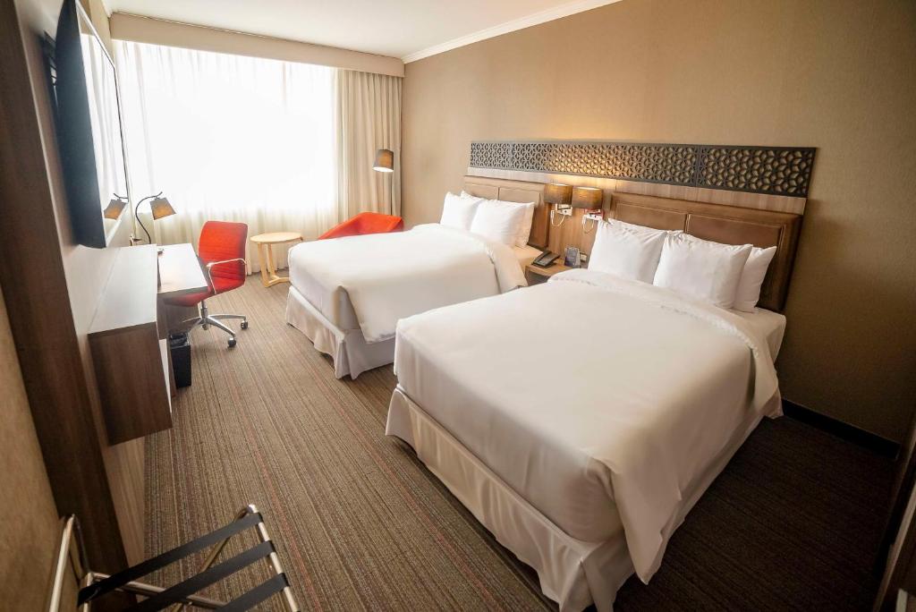 Postel nebo postele na pokoji v ubytování Doubletree By Hilton Trujillo
