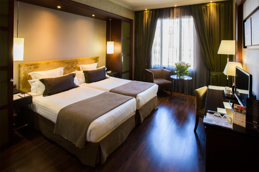 Posteľ alebo postele v izbe v ubytovaní Hotel Barcelona Center