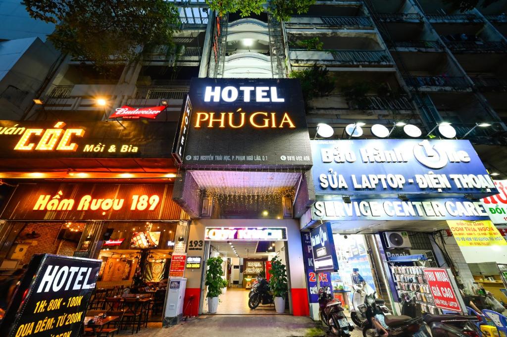 a group of shops in a city at night at Phu Gia Hotel 193 Nguyen Thai Hoc in Ho Chi Minh City