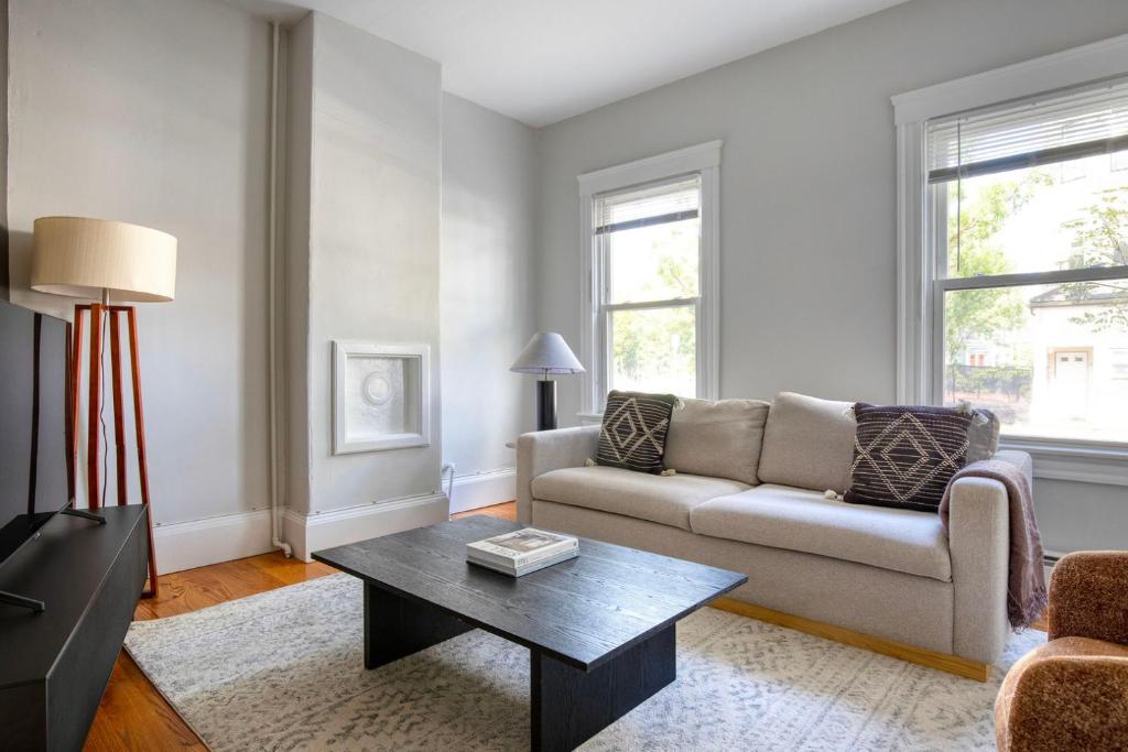 a living room with a couch and a coffee table at East Cambridge 3br w wd nr cafes bars BOS-910 in Cambridge