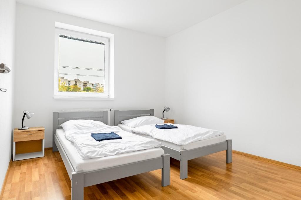 Postel nebo postele na pokoji v ubytování Apartmány Borská Plzeň