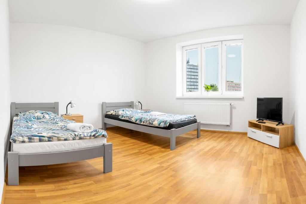 Postel nebo postele na pokoji v ubytování Apartmány Borská Plzeň