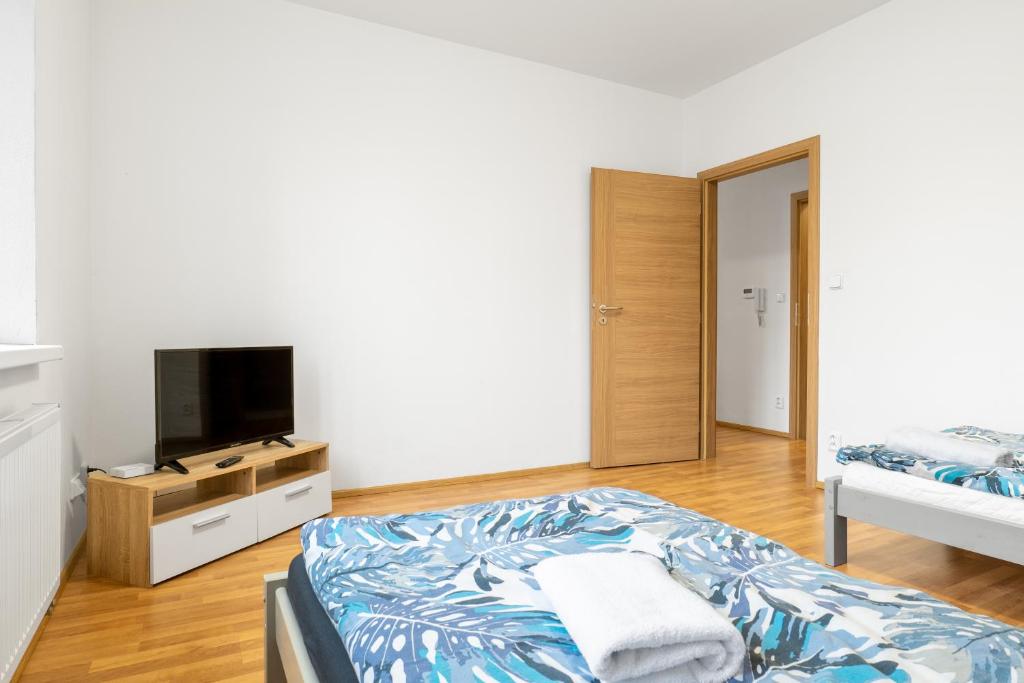 Postel nebo postele na pokoji v ubytování Apartmány Borská Plzeň
