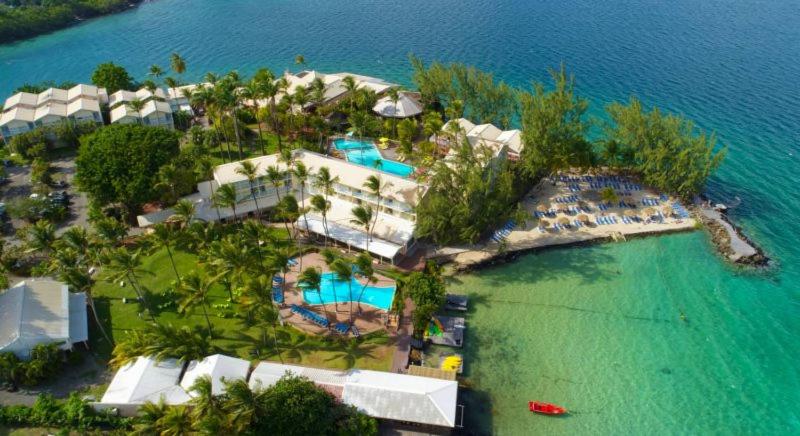 an aerial view of a resort in the water at Studio Fresh&amp;Cosy Trois-Ilets - 3 étoiles-Hotel Carayou in Les Trois-Îlets