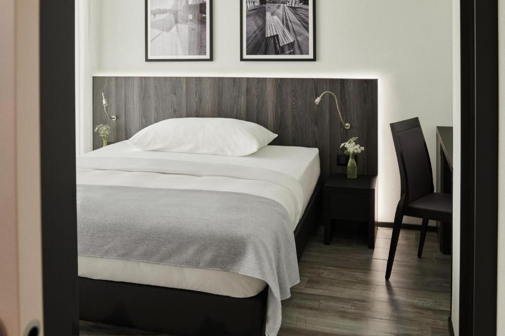Postel nebo postele na pokoji v ubytování THREE POINT Apartments