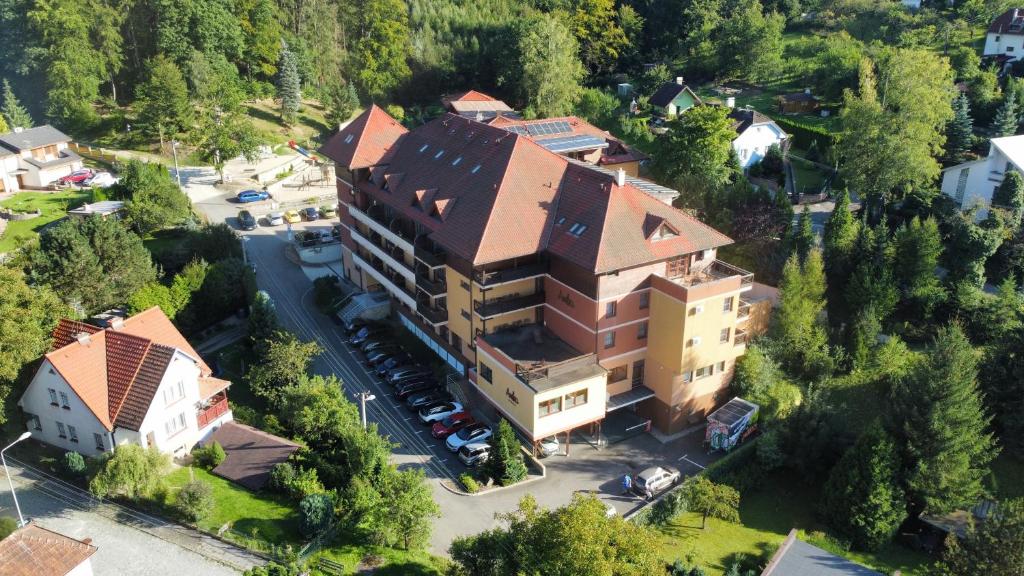 an aerial view of a building in a small town at Wellness Hotel Ambra in Luhačovice