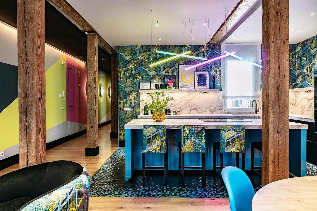 a kitchen with a blue island in a room at BILBAO DREAMS Luxury in Bilbao
