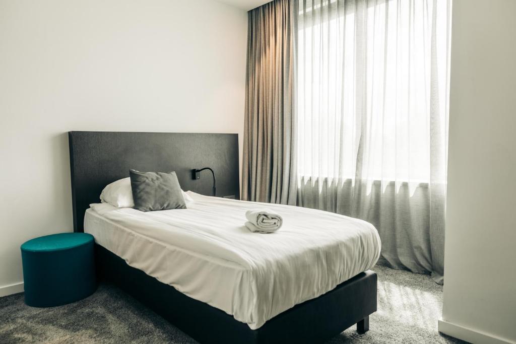 Postel nebo postele na pokoji v ubytování Serwir Hotel