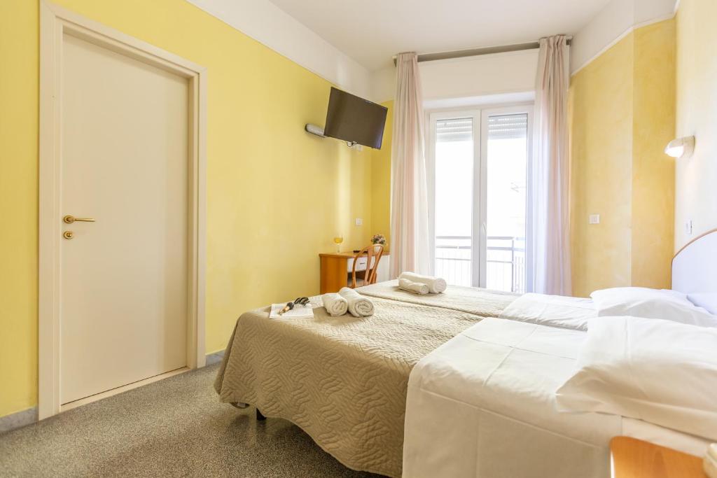 Postel nebo postele na pokoji v ubytování Hotel Naica