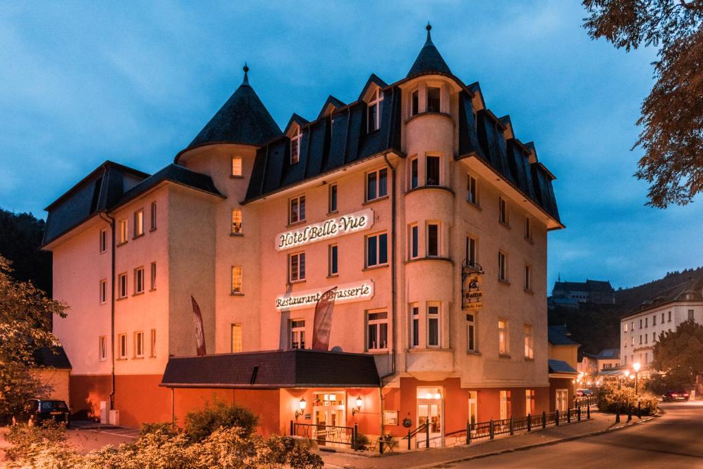 a large white building with a black roof at Hotel Belle Vue in Vianden