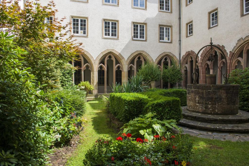 a garden in front of a building at Hotel Belle Vue in Vianden