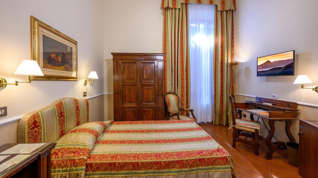 Postel nebo postele na pokoji v ubytování Hotel Posta