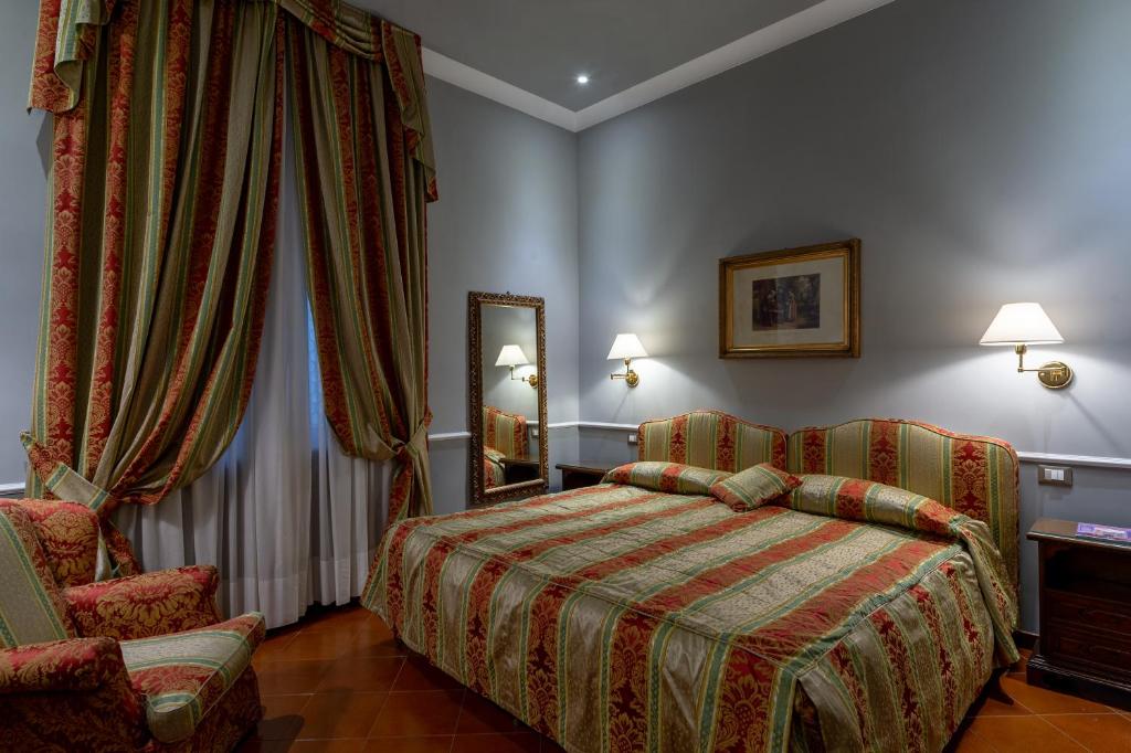 Postel nebo postele na pokoji v ubytování Hotel Posta