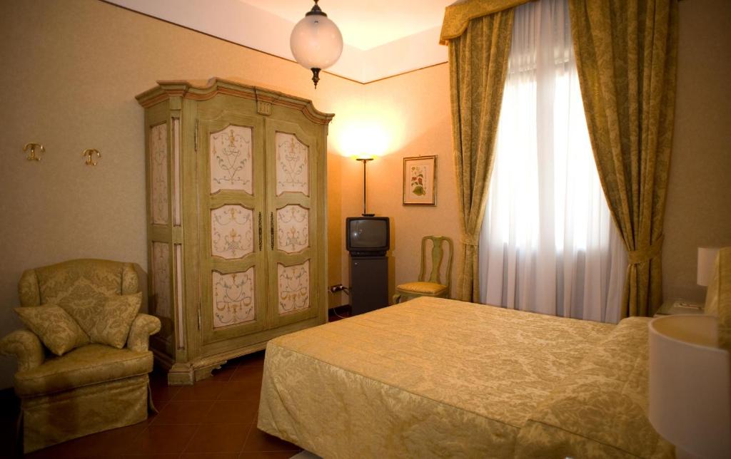 Postel nebo postele na pokoji v ubytování Hotel Posta