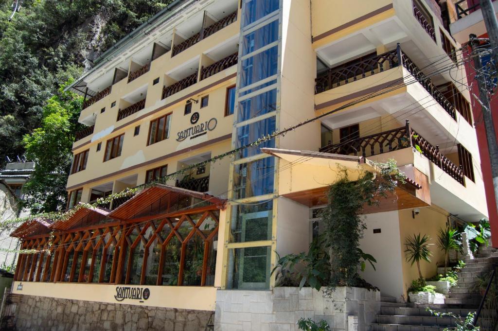 a building with a staircase in front of it at Santuario Machupicchu in Machu Picchu