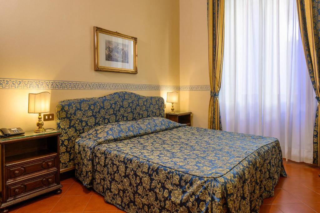 Postel nebo postele na pokoji v ubytování Hotel Posta