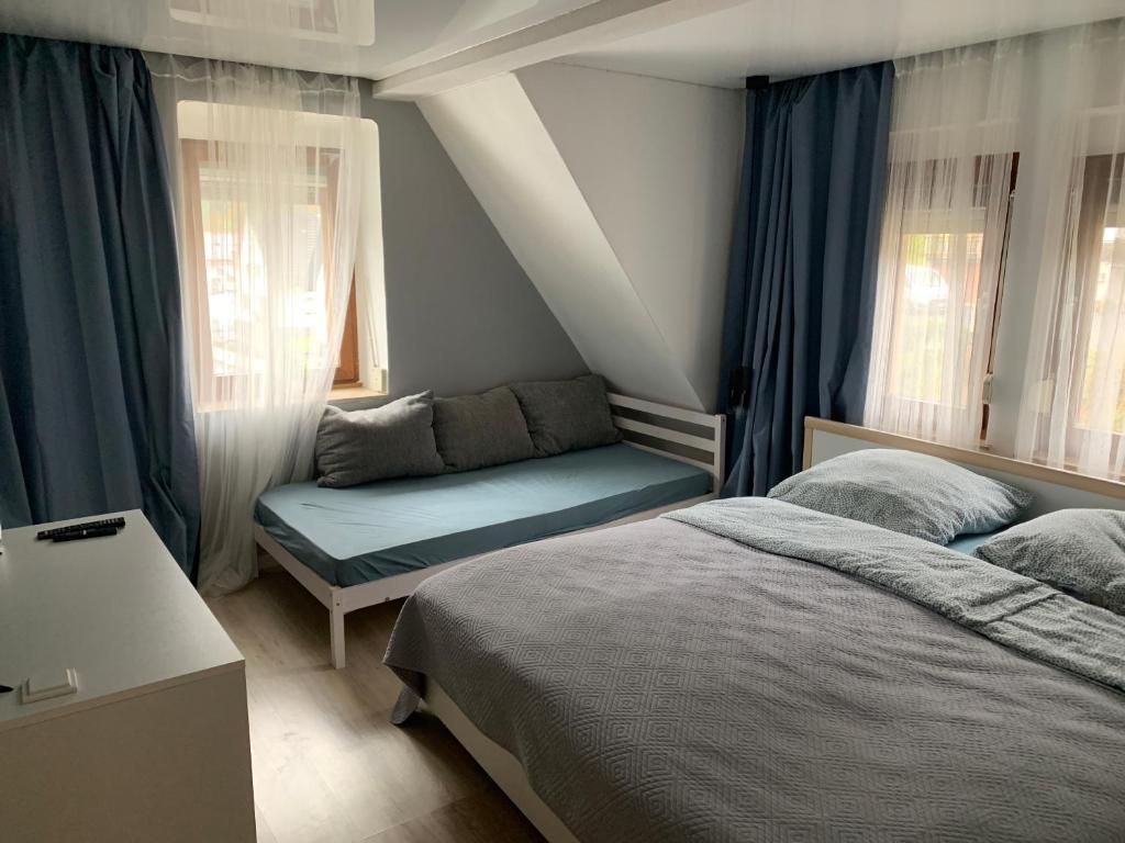 Postel nebo postele na pokoji v ubytování Gasthaus L&A Kunz