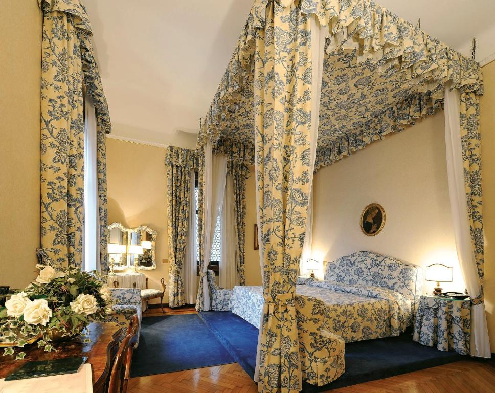 Postel nebo postele na pokoji v ubytování Hotel Posta