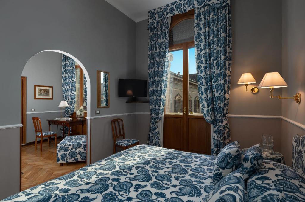 Postel nebo postele na pokoji v ubytování Hotel Posta