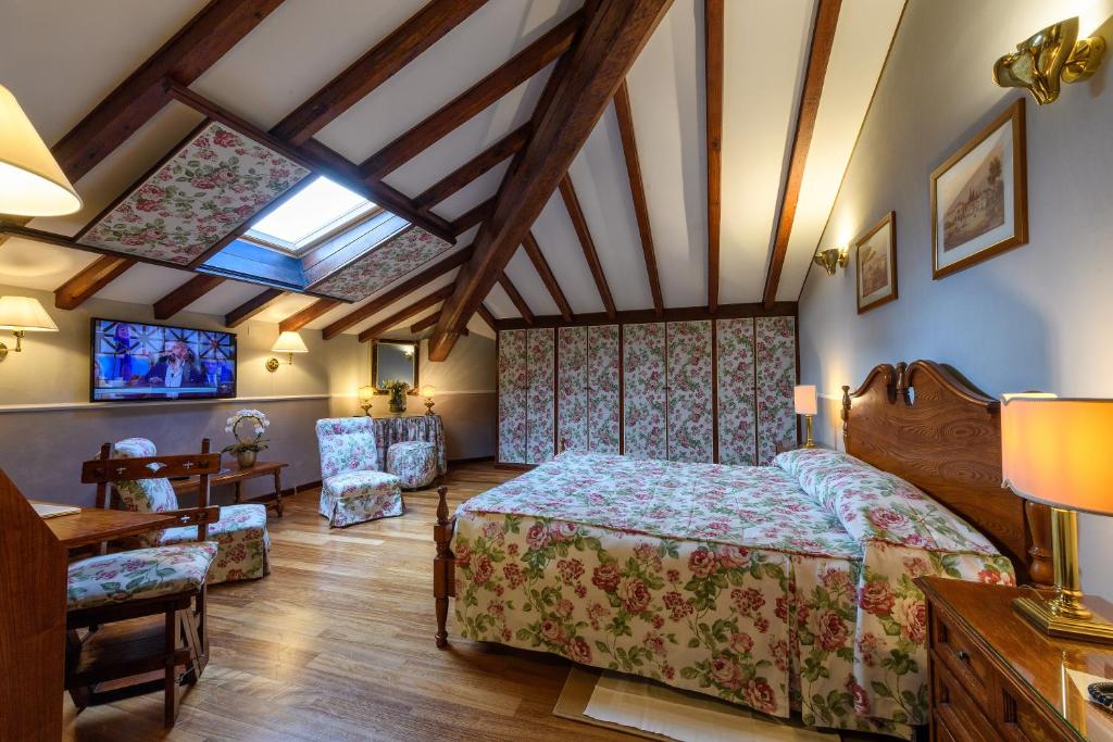 Postel nebo postele na pokoji v ubytování Hotel Posta