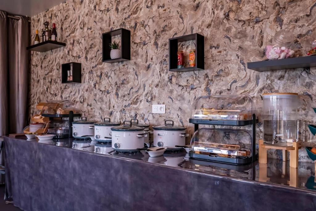 Kuchyň nebo kuchyňský kout v ubytování Hôtel du Moulin de la Brevette