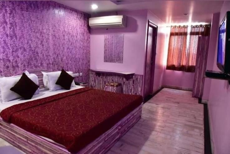 Postel nebo postele na pokoji v ubytování HOTEL HAYAT RESIDENCY