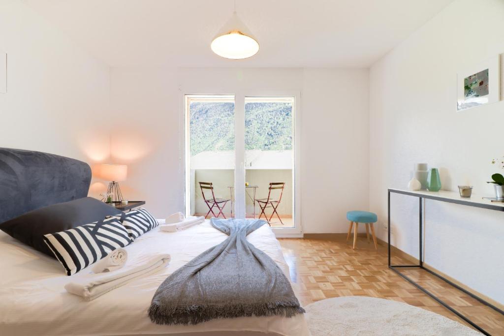 Postel nebo postele na pokoji v ubytování Nice apartment ideally located in Martigny