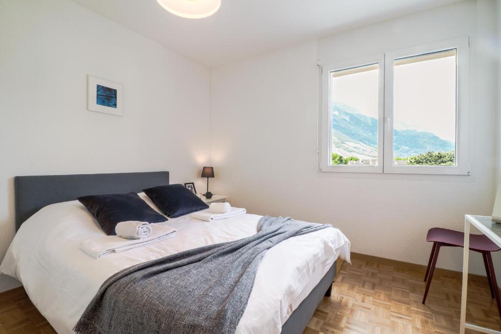 Postel nebo postele na pokoji v ubytování Nice apartment ideally located in Martigny