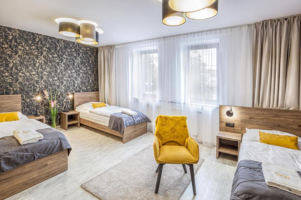 Postel nebo postele na pokoji v ubytování Hotel Beta