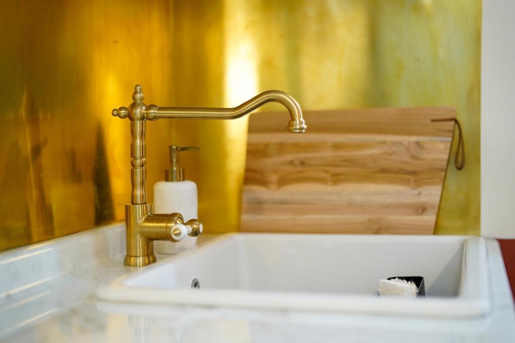 a sink with a faucet in a bathroom at Malta Luxe Guest Suite Central Location in Mosta