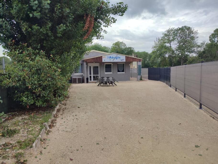 a building with a group of dogs in front of it at Maison pour 6 personnes in Lassicourt