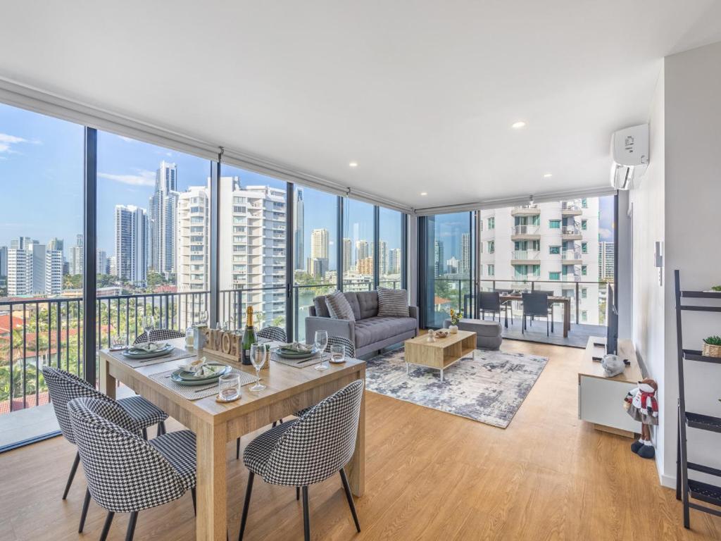 a living room with a table and chairs at Riverside 2BR delicate apt in Gold Coast