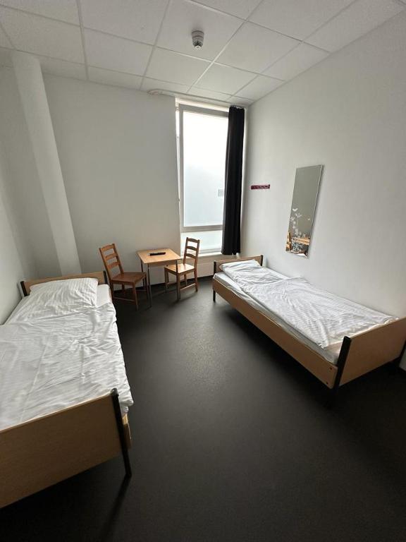 Postel nebo postele na pokoji v ubytování Arena Hostel & Monteurzimmer
