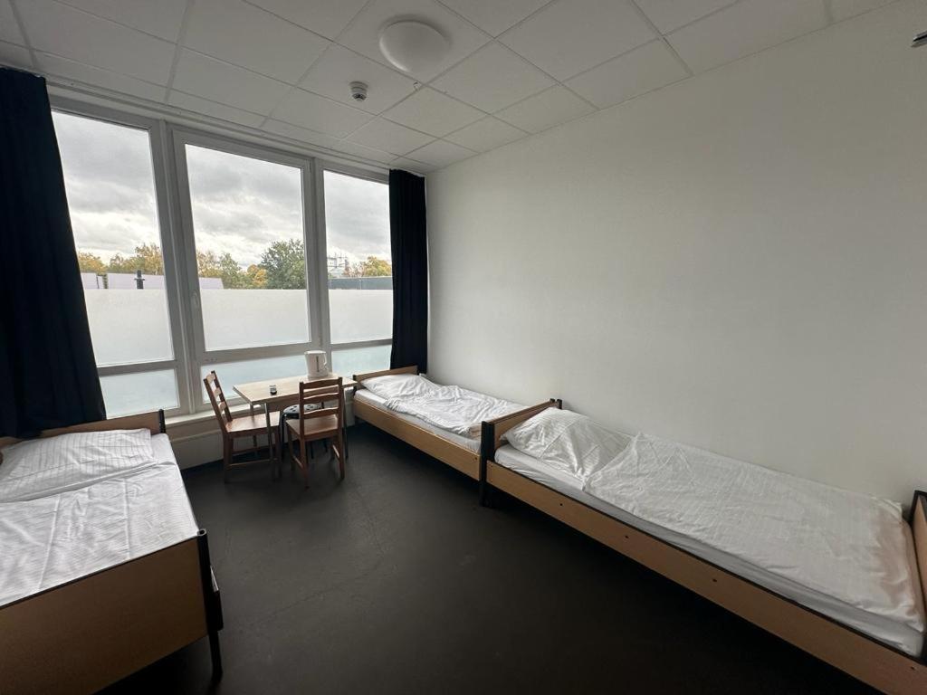 Postel nebo postele na pokoji v ubytování Arena Hostel & Monteurzimmer