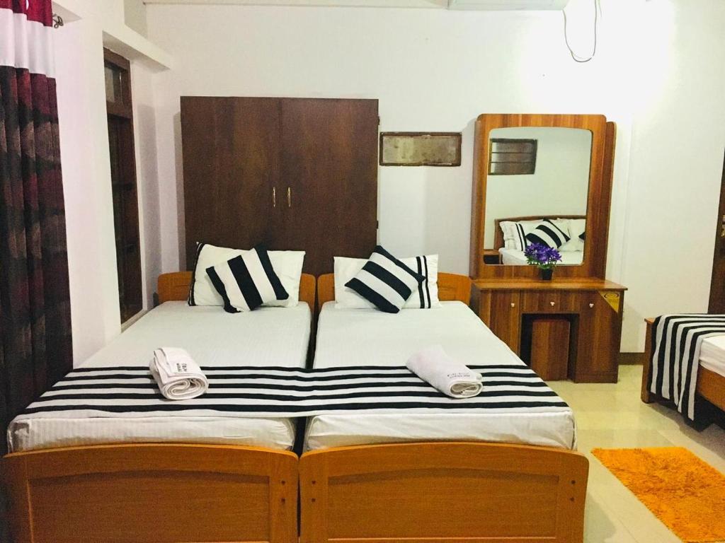 Postel nebo postele na pokoji v ubytování Aura City Hostel