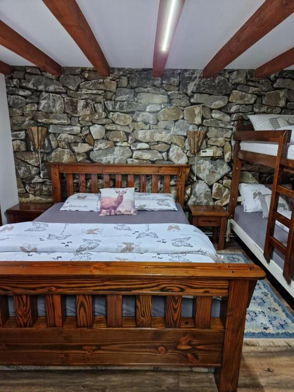Postel nebo postele na pokoji v ubytování Vikendica Kločanica