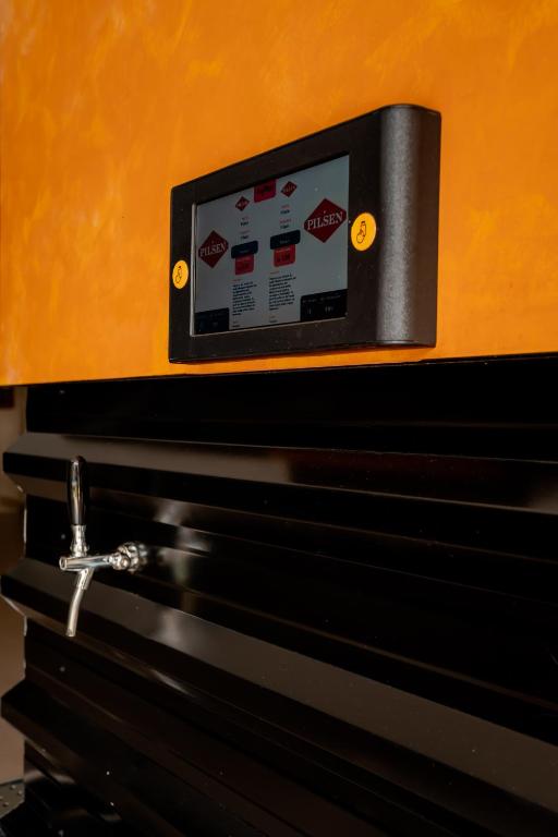 a soap dispenser on the side of a wall at Megal Suites Hotel in Ciudad del Este
