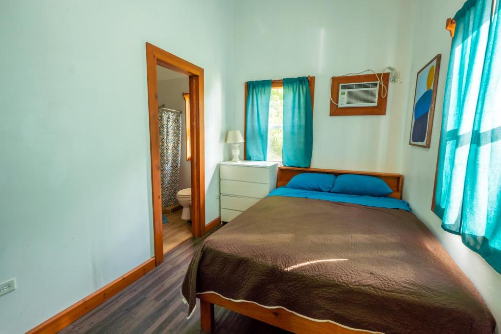 Postel nebo postele na pokoji v ubytování TropicalArts Resort&Studios