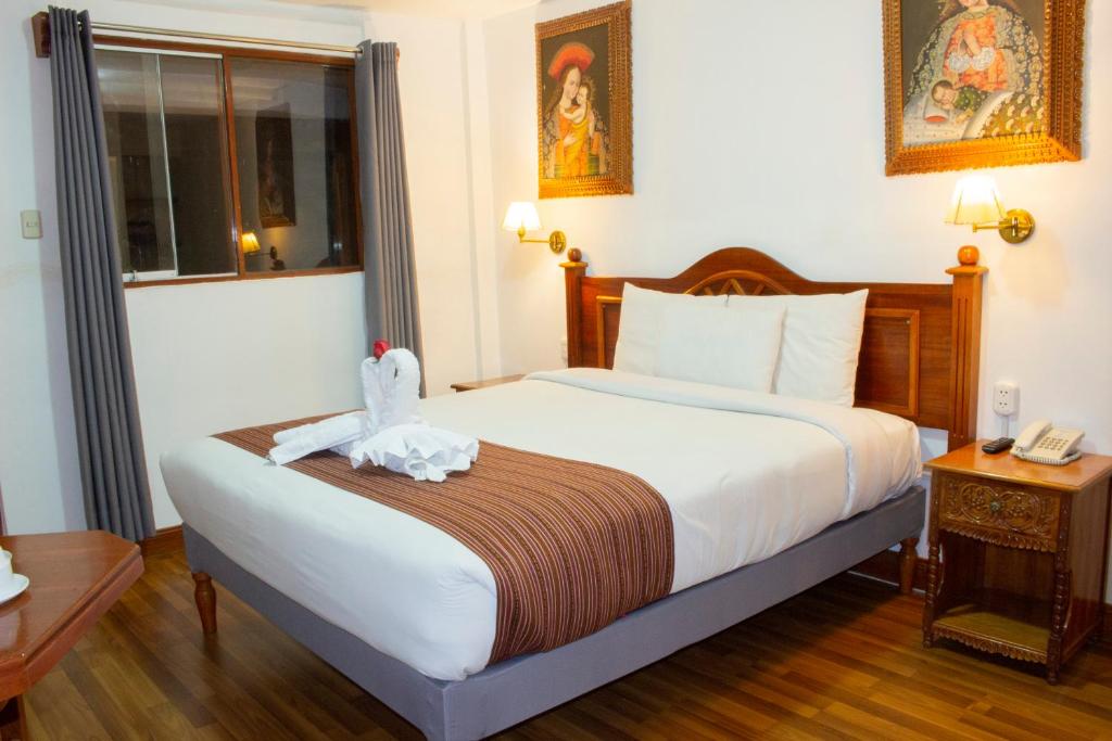 Postel nebo postele na pokoji v ubytování Hotel Amerinka