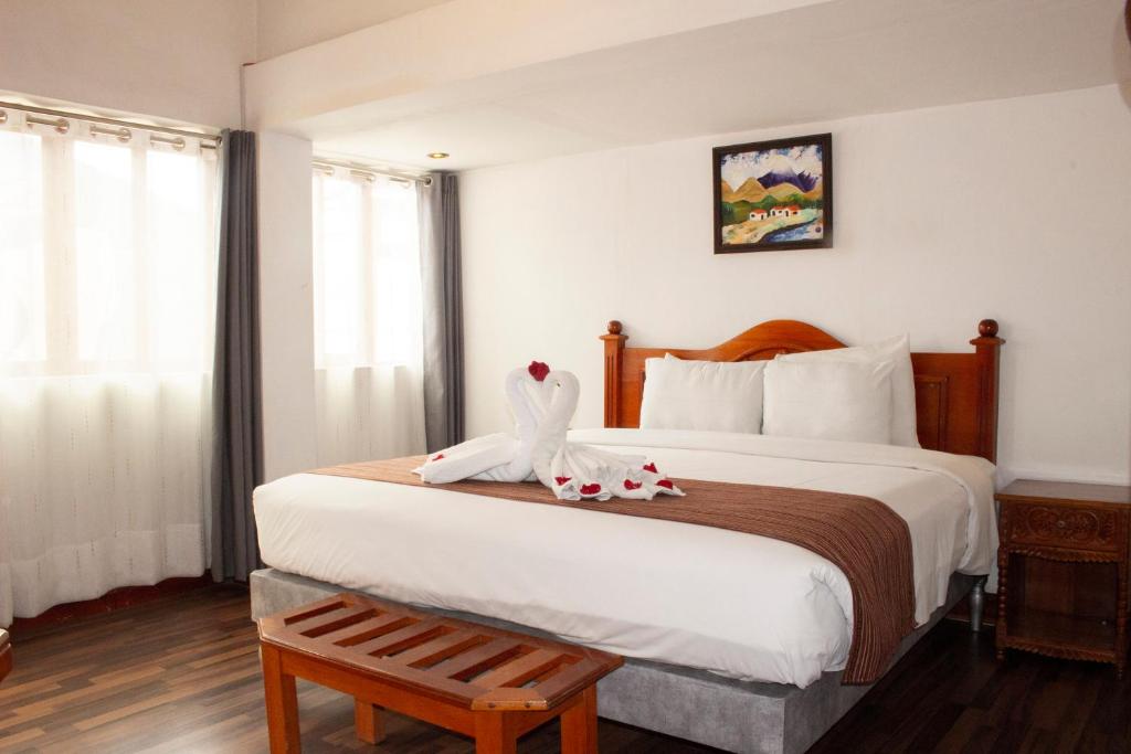 Postel nebo postele na pokoji v ubytování Hotel Amerinka