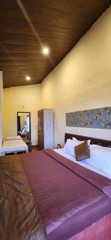 Postel nebo postele na pokoji v ubytování Mysticstays Resort